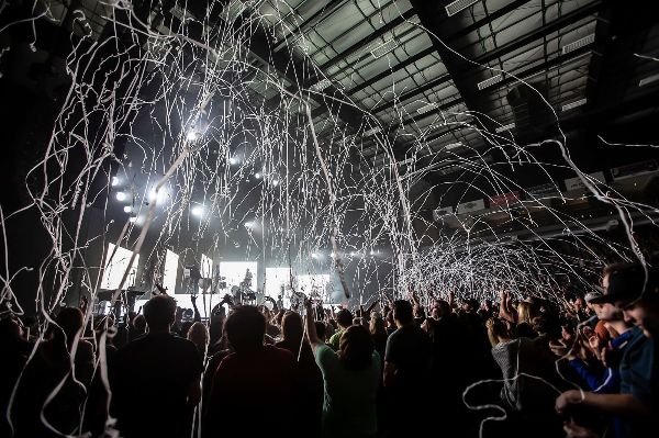 concert with streamers falling from ceiling